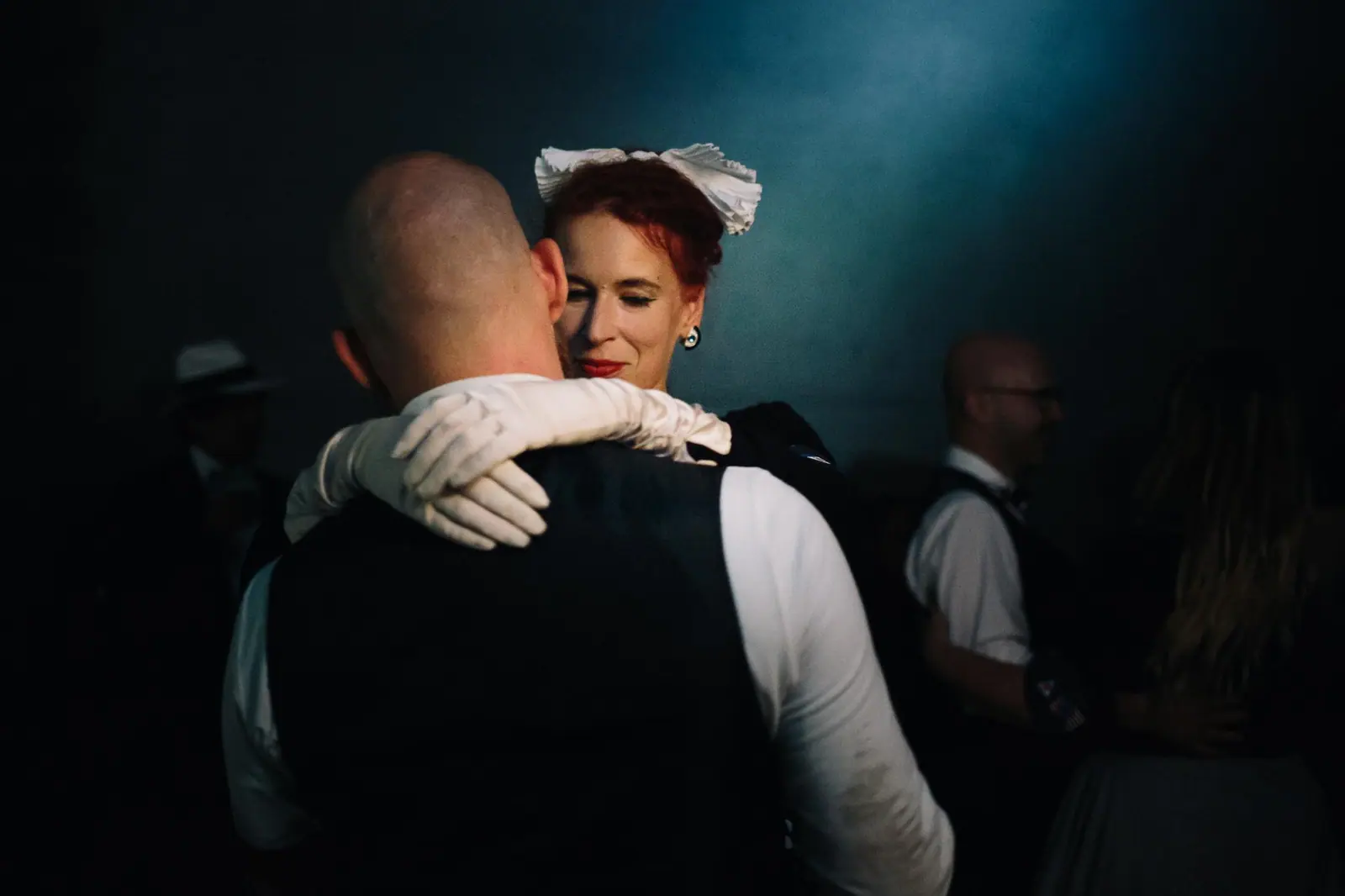 Two participants holding each other during a scene