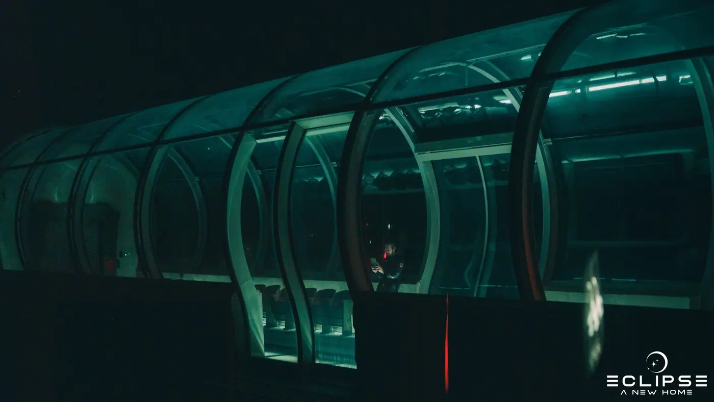 The teal-lit interior of the ship set