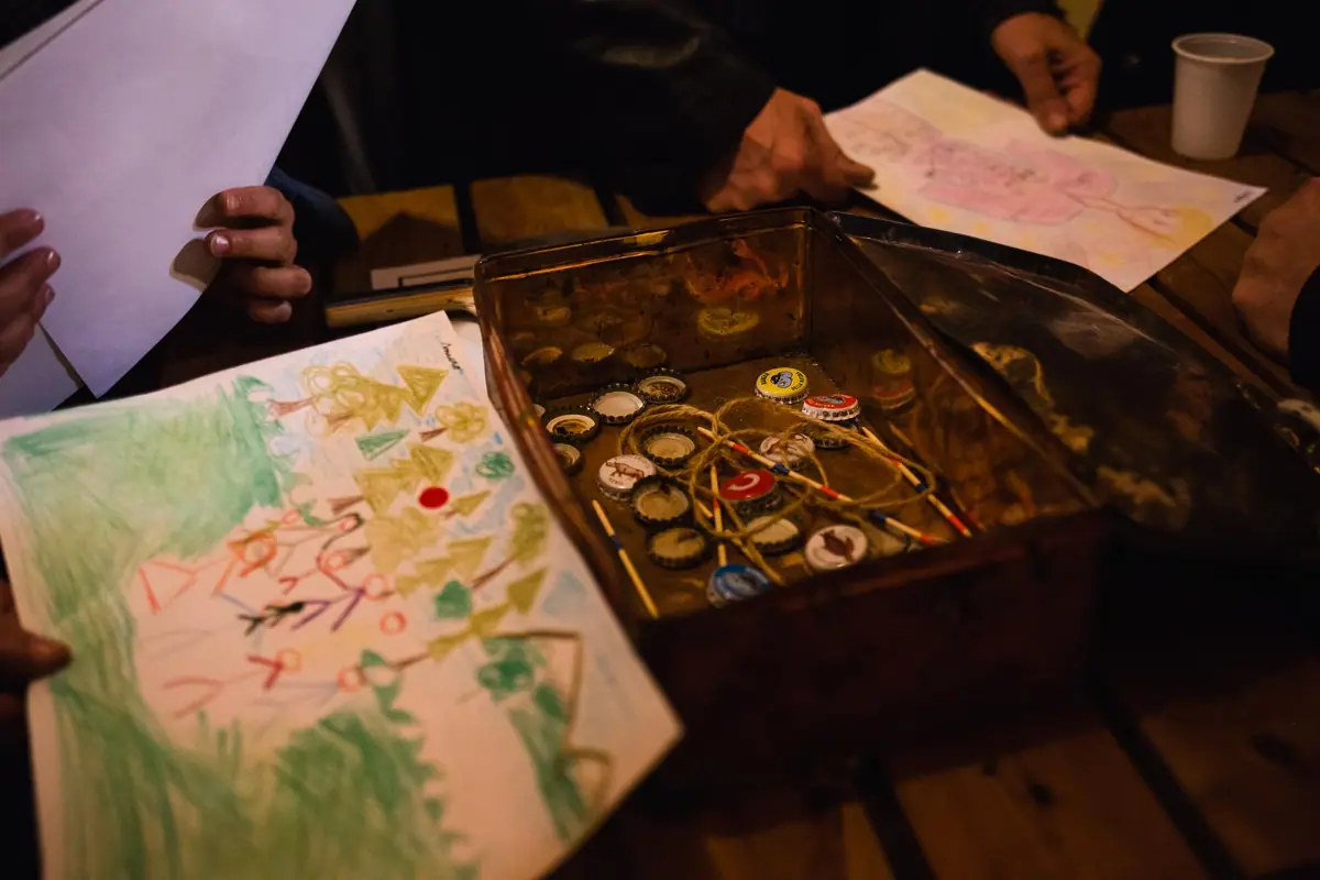 A hand-drawn map and props laid out on a table
