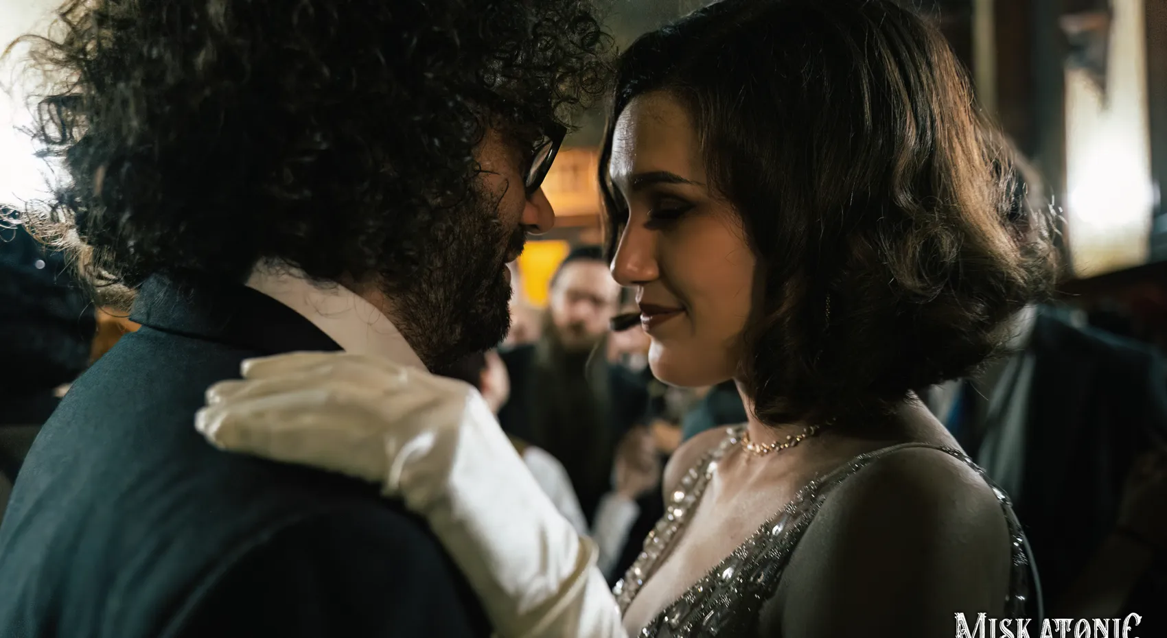 A couple dancing close at the ball